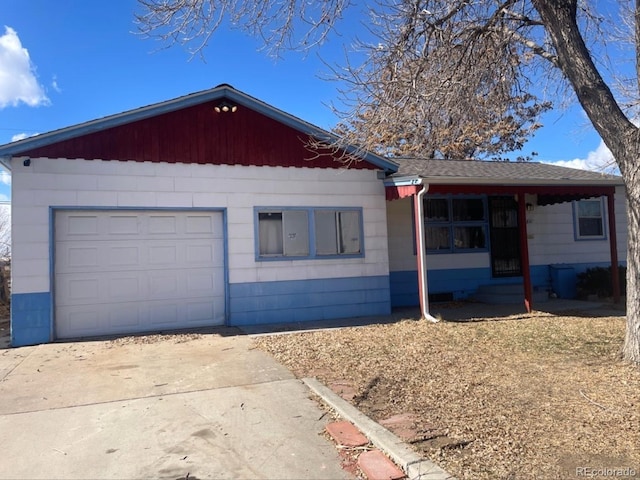 ranch-style house with driveway and an attached garage