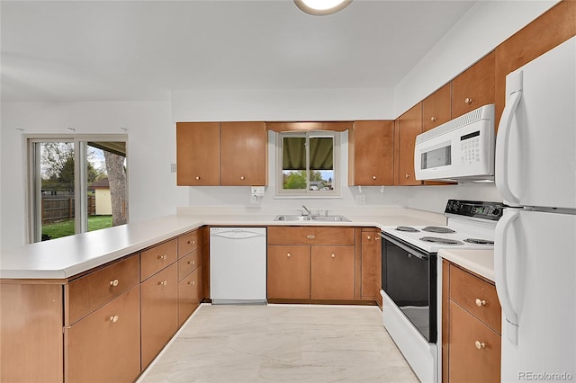 1304 De Reamer Cir, Colorado Springs, CO 80915 - kitchen featuring white appliances, light marble finish flooring, a peninsula, a sink, and light countertops