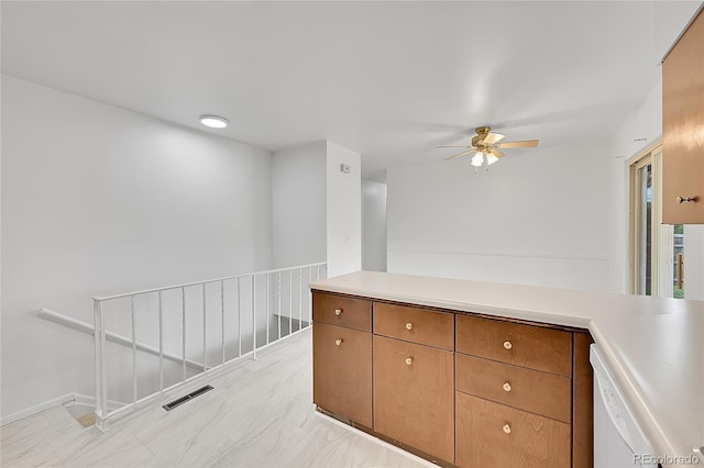 1304 De Reamer Cir, Colorado Springs, CO 80915 - kitchen featuring ceiling fan, light countertops, and brown cabinets