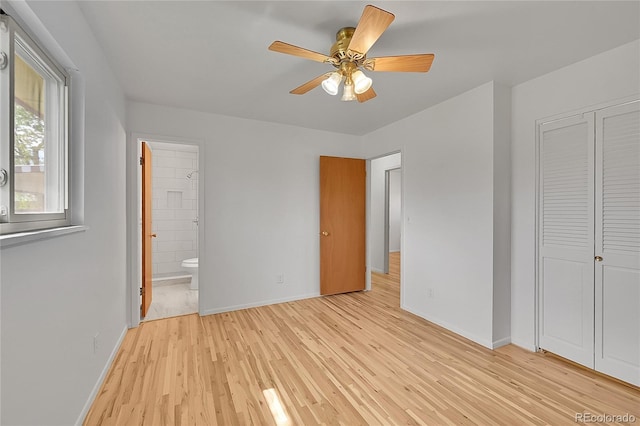 1304 De Reamer Cir, Colorado Springs, CO 80915 - unfurnished bedroom featuring light wood-style flooring, baseboards, ensuite bath, and a closet