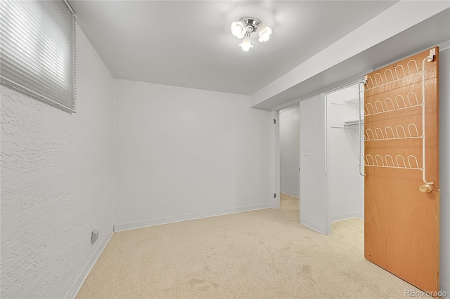 1304 De Reamer Cir, Colorado Springs, CO 80915 - unfurnished bedroom with light carpet, baseboards, a closet, and a walk in closet