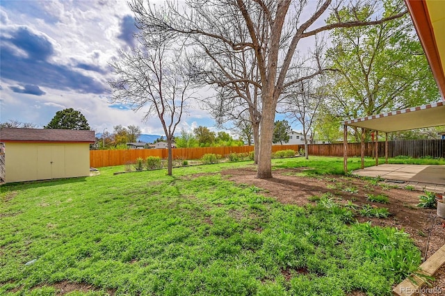 1304 De Reamer Cir, Colorado Springs, CO 80915 - view of yard featuring a patio area and an outbuilding