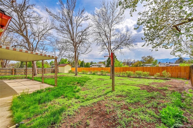 1304 De Reamer Cir, Colorado Springs, CO 80915 - view of yard featuring a storage shed, a patio, and an outbuilding