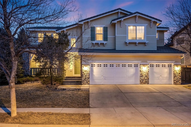 view of front facade with a garage and driveway