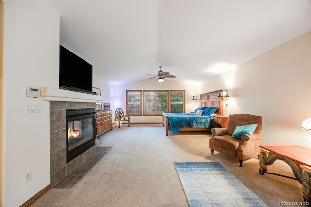 carpeted bedroom featuring baseboards, a fireplace, a ceiling fan, and lofted ceiling