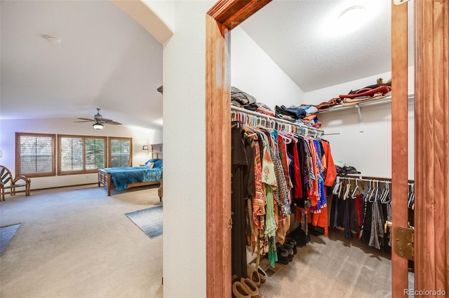 spacious closet with pool table, vaulted ceiling, carpet flooring, and ceiling fan