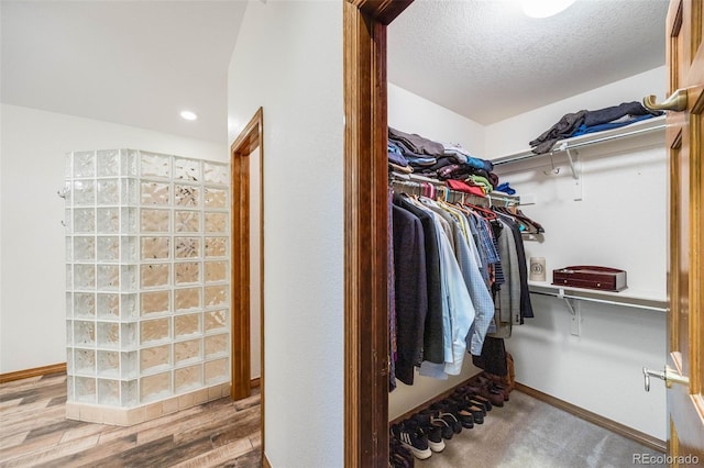 spacious closet featuring wood finished floors