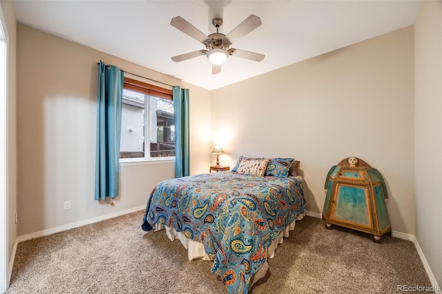 carpeted bedroom featuring ceiling fan and baseboards