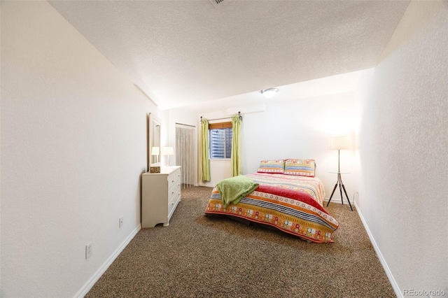 bedroom featuring a textured ceiling, a textured wall, carpet floors, baseboards, and vaulted ceiling