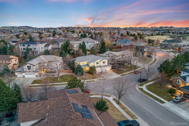 aerial view at dusk with a residential view