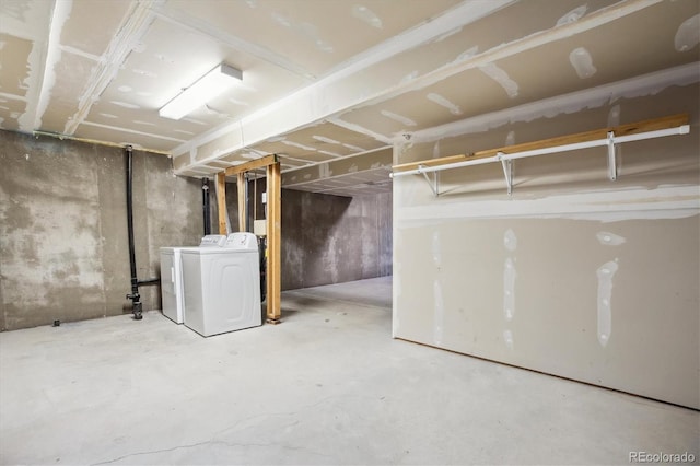 unfinished basement featuring independent washer and dryer