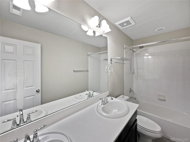 full bathroom with toilet, a sink, and visible vents