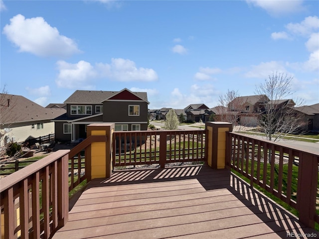 wooden deck with a residential view