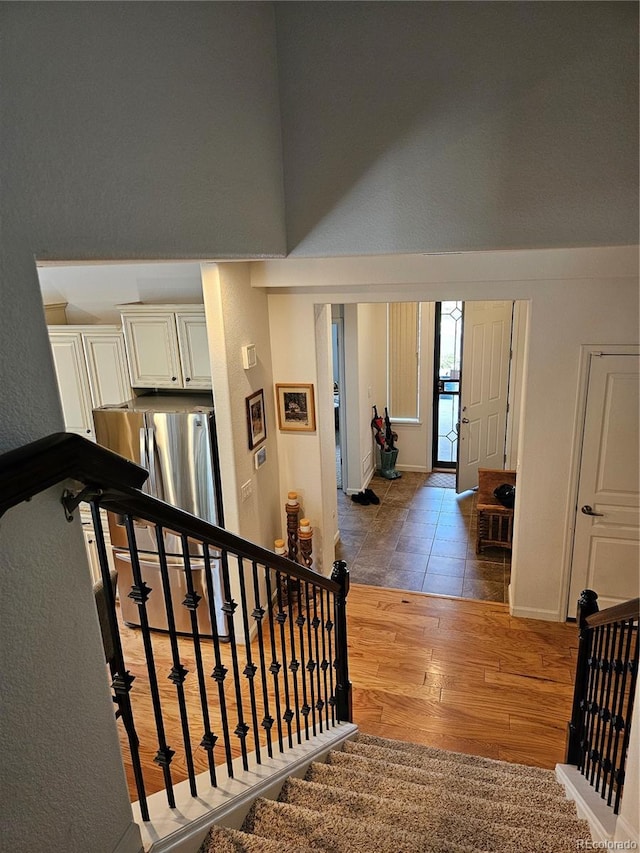 stairway featuring hardwood / wood-style flooring