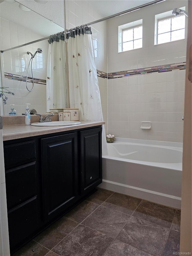 bathroom featuring shower / tub combo and vanity