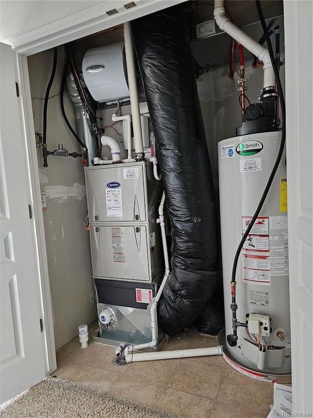 utility room featuring gas water heater