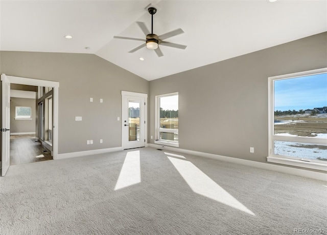 unfurnished room featuring vaulted ceiling, light colored carpet, and ceiling fan