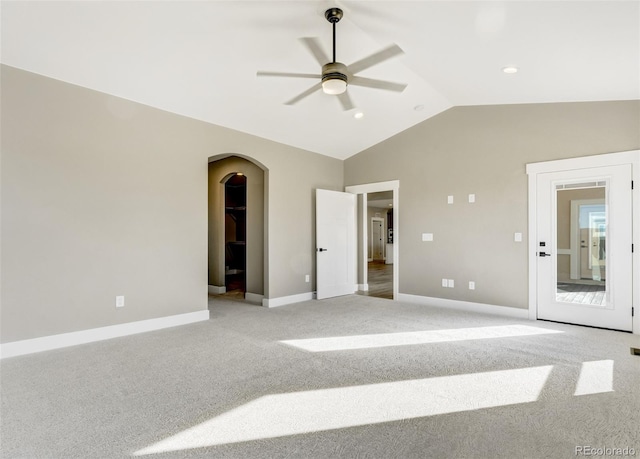 unfurnished bedroom with lofted ceiling, light colored carpet, and ceiling fan