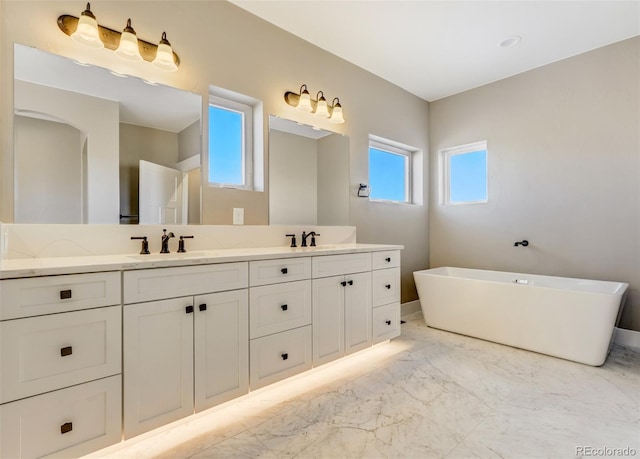 bathroom featuring vanity and a tub to relax in