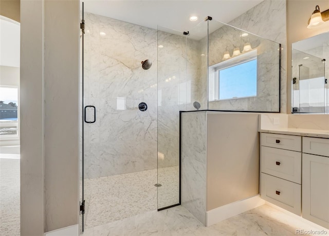 bathroom featuring vanity and an enclosed shower