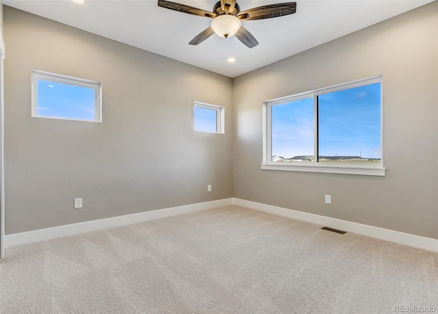 unfurnished room with ceiling fan and carpet floors