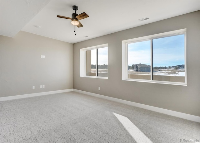 unfurnished room with carpet floors and ceiling fan