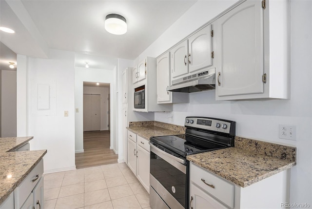 kitchen with stainless steel electric range oven, light stone countertops, baseboards, light tile patterned floors, and under cabinet range hood