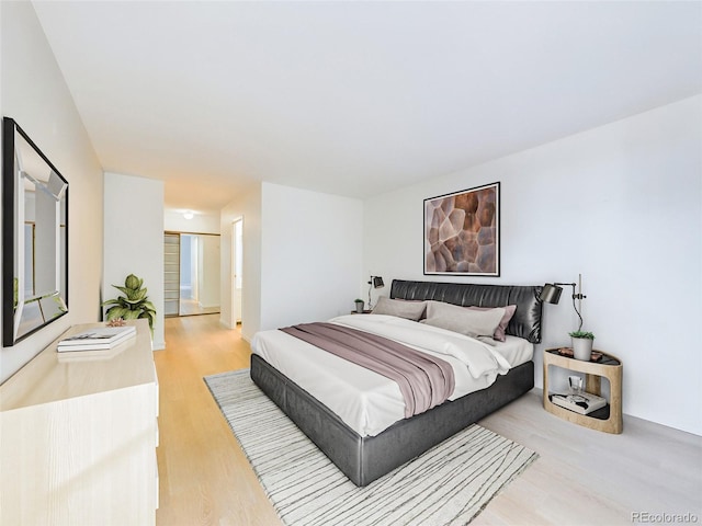 bedroom with light wood finished floors