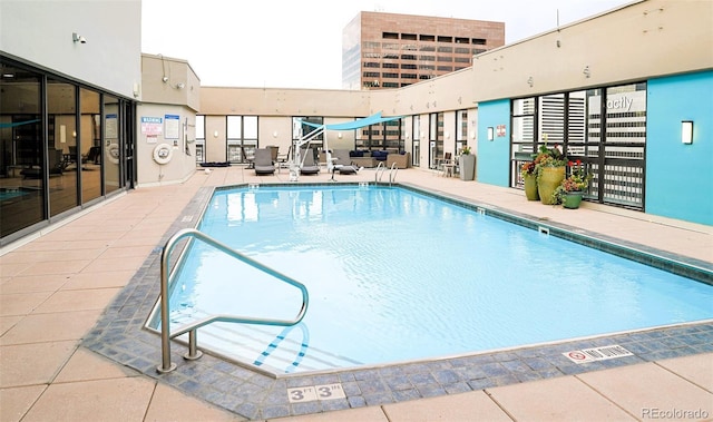 community pool with a patio