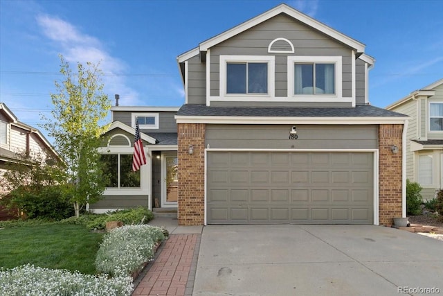 180 S Carlton St, Castle Rock, CO 80104 - traditional home featuring brick siding, an attached garage, and concrete driveway