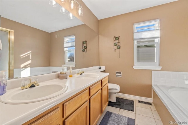 180 S Carlton St, Castle Rock, CO 80104 - full bath featuring a garden tub, double vanity, toilet, and baseboards