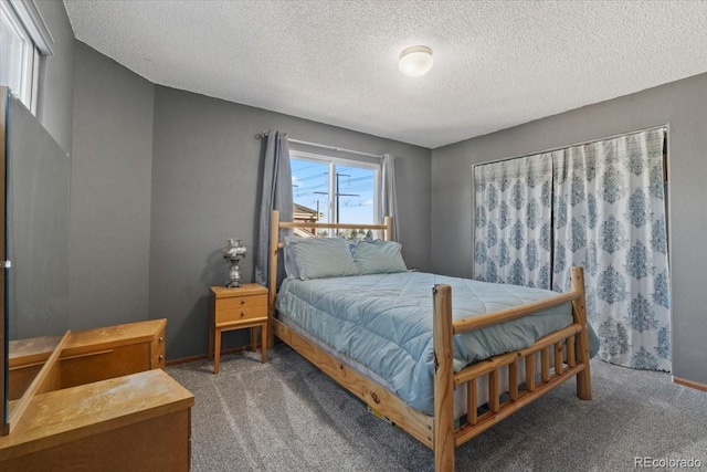 180 S Carlton St, Castle Rock, CO 80104 - carpeted bedroom featuring a textured ceiling