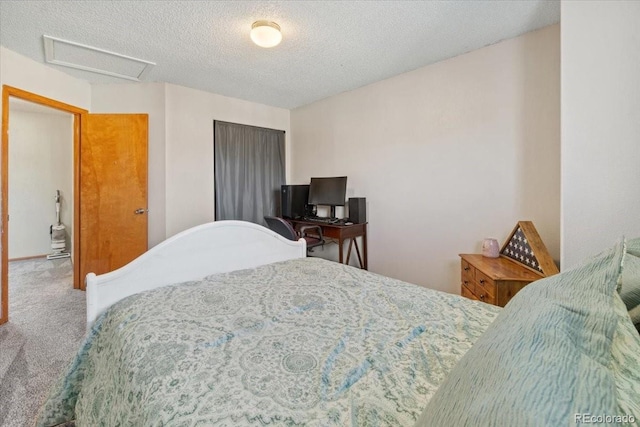 180 S Carlton St, Castle Rock, CO 80104 - bedroom featuring attic access, carpet, and a textured ceiling