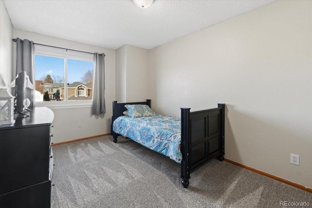 180 S Carlton St, Castle Rock, CO 80104 - bedroom with carpet floors, baseboards, and a textured ceiling