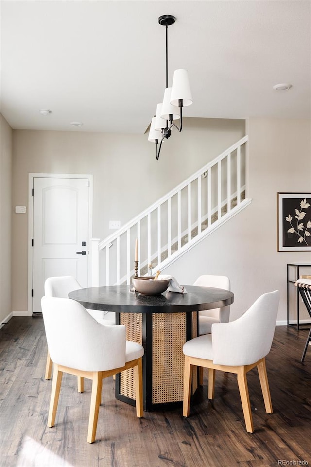 dining room with hardwood / wood-style flooring