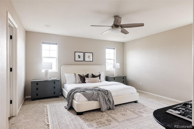 bedroom with light colored carpet and ceiling fan