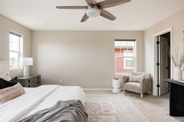 bedroom with ceiling fan and light colored carpet