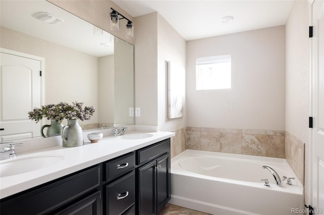 bathroom with vanity and a bathing tub