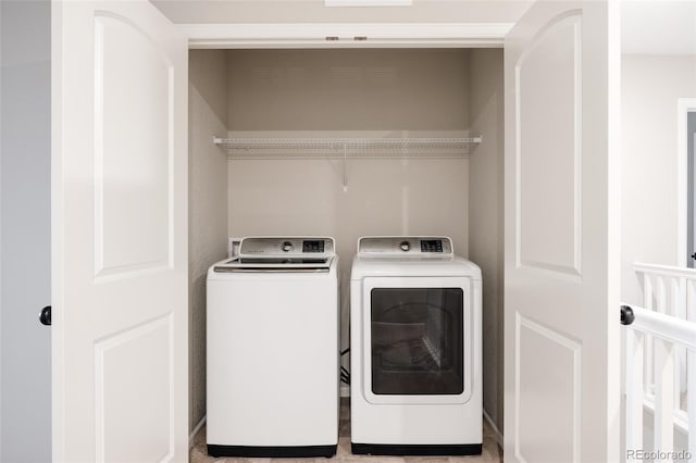 washroom with washer and clothes dryer