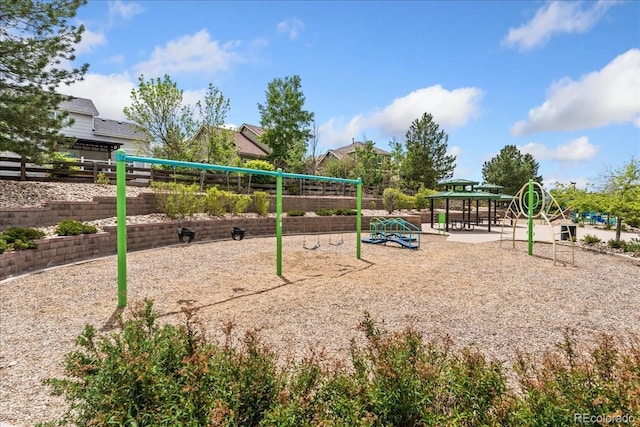 view of property's community featuring fence