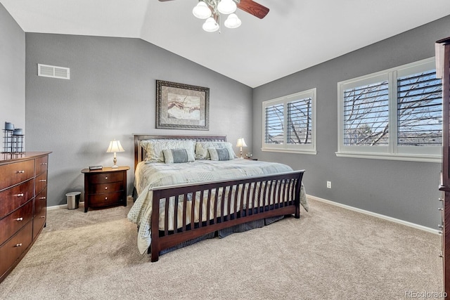 carpeted bedroom featuring ceiling fan and vaulted ceiling