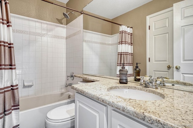 full bathroom featuring toilet, vanity, and shower / bathtub combination with curtain