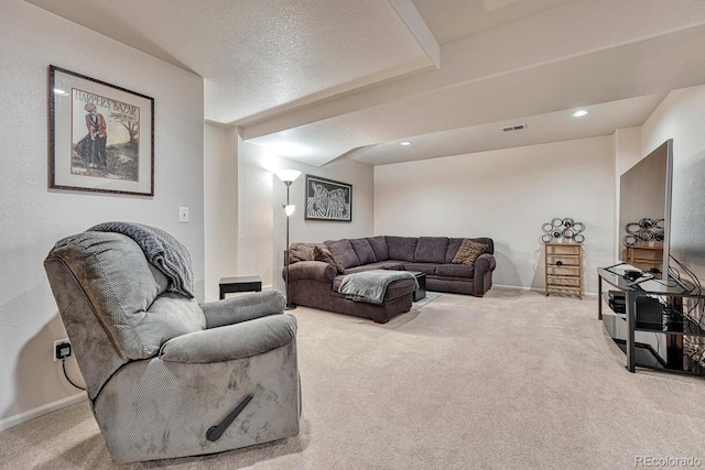 carpeted living room with a textured ceiling