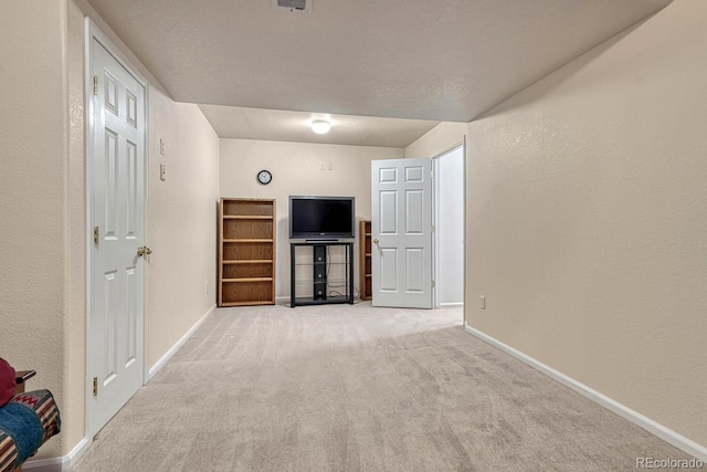 unfurnished living room with carpet floors