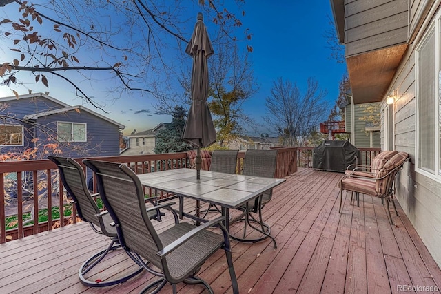 wooden terrace featuring a grill