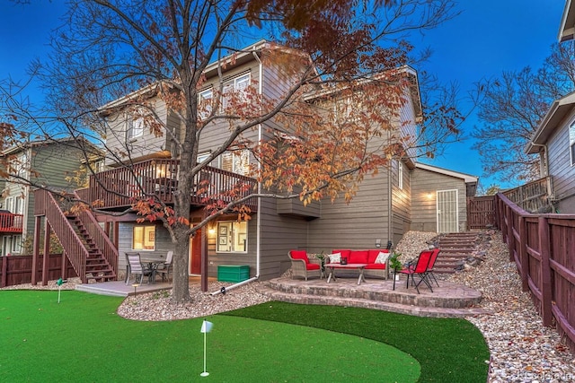 rear view of house featuring a patio area and outdoor lounge area