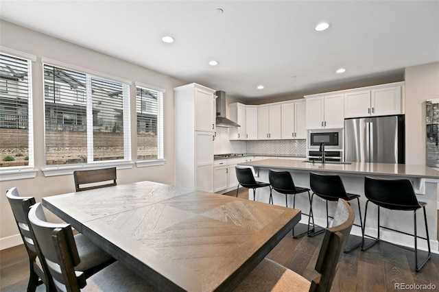 11350 W Grand Ave, Littleton, CO 80127 - dining space featuring dark wood-type flooring and recessed lighting
