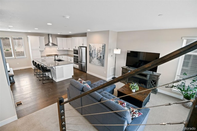 11350 W Grand Ave, Littleton, CO 80127 - living area with recessed lighting, dark wood-style flooring, baseboards, and visible vents