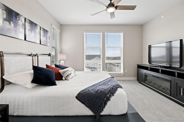 11350 W Grand Ave, Littleton, CO 80127 - bedroom with light colored carpet, baseboards, and a ceiling fan