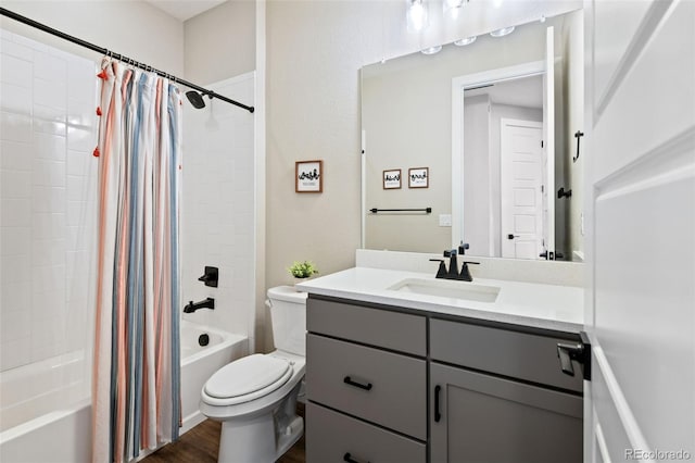 11350 W Grand Ave, Littleton, CO 80127 - bathroom featuring shower / bath combo, toilet, vanity, and wood finished floors
